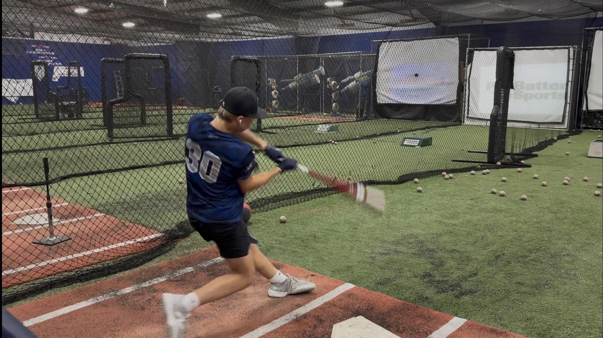 Carter Adkins hitting swing in the batting cage